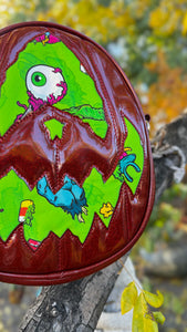 Handcrafted Rotten Egg Oval: Red Glitter and green Grave Offerings material
