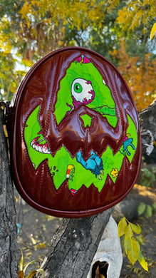 Handcrafted Rotten Egg Oval: Red Glitter and green Grave Offerings material