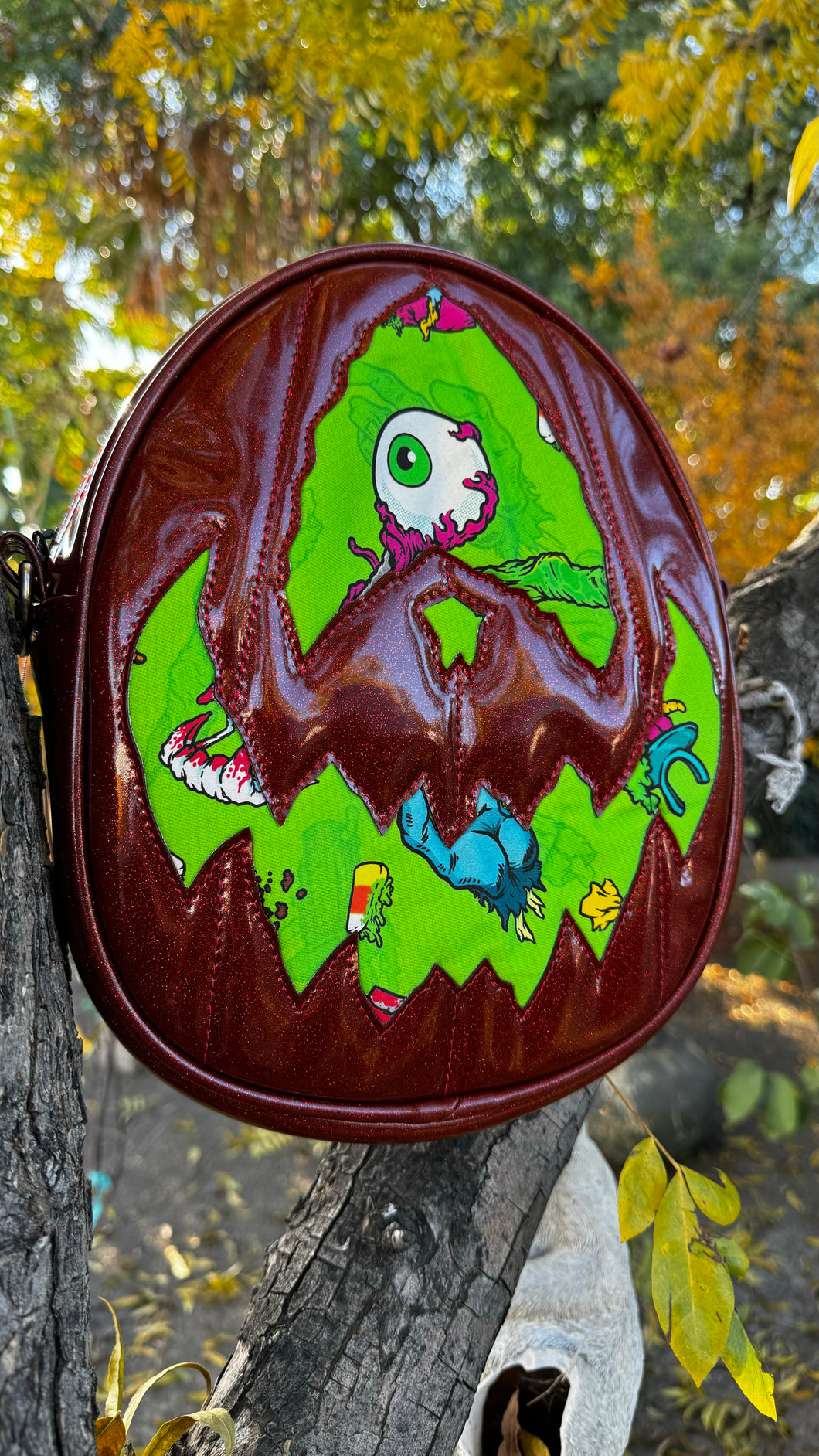 Handcrafted Rotten Egg Oval: Red Glitter and green Grave Offerings material