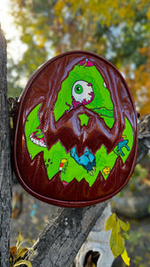 Handcrafted Rotten Egg Oval: Red Glitter and green Grave Offerings material