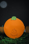 back view of orange snap wallet debossed with the Pumpkin Kult logo