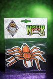 Orange spider hanging car freshener. 