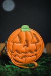 Orange jack-o-lantern zip top wallet with wrist strap