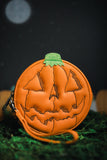 Orange jack-o-lantern zip top wallet with wrist strap