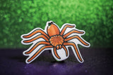 Orange spider hanging car freshener. 