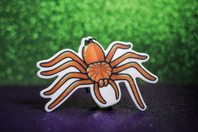 Orange spider hanging car freshener. 