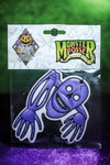 Purple skeleton car air freshener on green background.