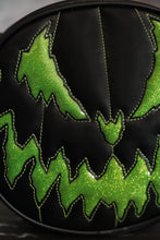 Load image into Gallery viewer, Evil faced pumpkin bag in Black vinyl and Green glitter vinyl . Close up of the face. 