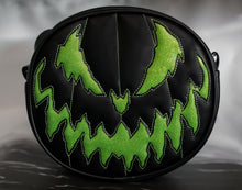 Load image into Gallery viewer, Evil faced pumpkin bag in Black vinyl and Green glitter vinyl 