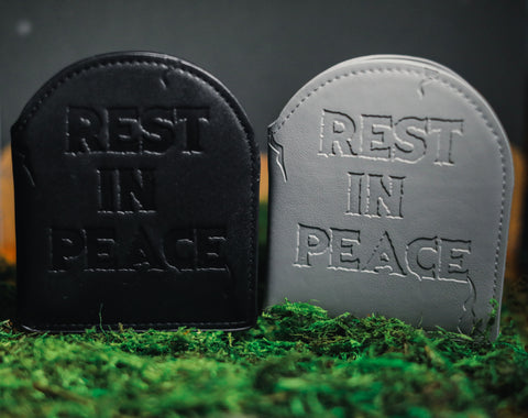 Black and grey headstone wallets debossed with "rest in peace" 