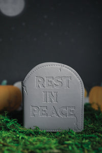 Grey headstone wallet debossed with "Rest In Peace" 