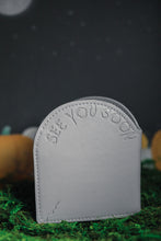 Load image into Gallery viewer, Back view of grey headstone wallet debossed with &quot;see you soon&quot;