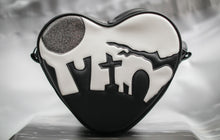 Load image into Gallery viewer, Heart shaped handbag in black and white vinyl silhouetted graveyard, glitter grey moon. 