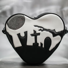 Load image into Gallery viewer, Heart shaped handbag in black and white vinyl silhouetted graveyard, glitter grey moon. 
