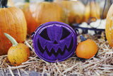 purple mini pumpkin bag in pumpkin background 