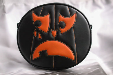 Black and orange crying pumpkin bag on white background. 
