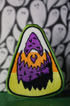 Candy corn with jack o lantern face. 