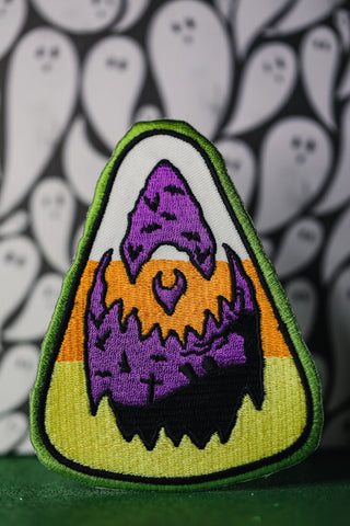 Candy corn with jack o lantern face. 