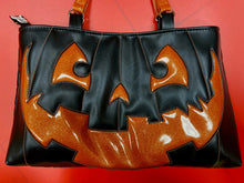 Load image into Gallery viewer, Large black and orange pumpkin shoulder bag.