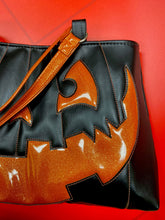 Load image into Gallery viewer, Large black and orange pumpkin shoulder bag.