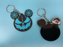 Load image into Gallery viewer, Front and back view of black and blue bat mouth jack-o-lantern with spiderweb mouse ears keychain.