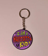 Load image into Gallery viewer, Close up of keychain that says &quot;I am a Halloween kid!&quot;