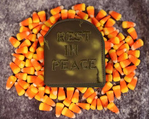 Tombstone shaped thermal sensitive wallet that is embroidered with "Rest In Peace"