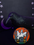 Sheet ghost and jack o lanterns with headstone that reads, "Rest in dust"