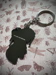 Strange and Unusual Enamel Keychain