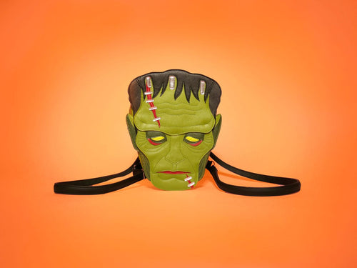 A stylized version of Frankenstein's Monster as a backpack against an orange background. 