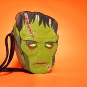 A stylized version of Frankenstein's Monster as a crossbody bag against an orange background. 