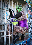 Girl dressed as monster wearing the monster bag, Glitter Purple and green glitter bag has black and white glitter pipping , green matching zipper